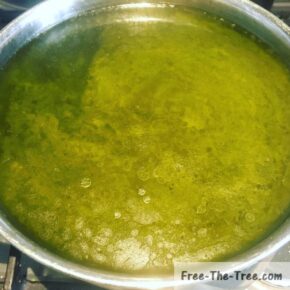 Liquid cannabutter in pot separated from stems&leaves